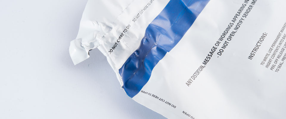 What makes the SCEC approved tamper evident bags extra secure is the aggressive adhesive that functions under extreme temperatures. When heated, the adhesive will continue to function and show void messages when forcibly removed. If enough heat is applied, the tape will warp and distort while the adhesive holds.