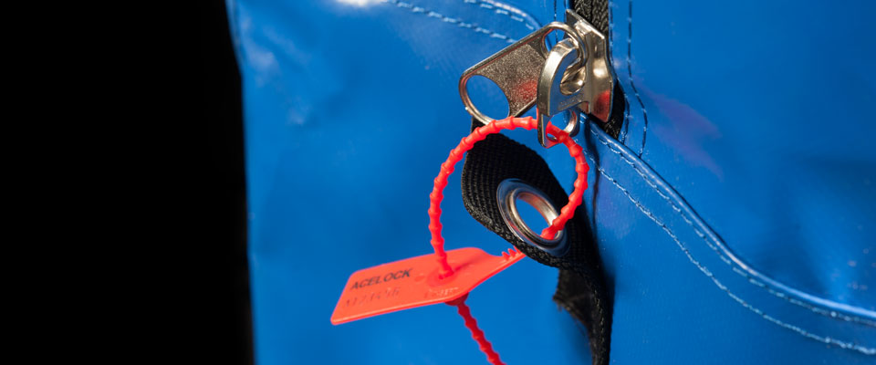 Large grade zippers are used, with similarly large eyelets to accommodate a wide variety of pull-tight seals.